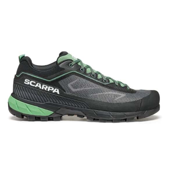 Scarpa Women's Rapid LT Approach Sneakers showcasing the Vibram Megagrip sole in a rocky outdoor setting.