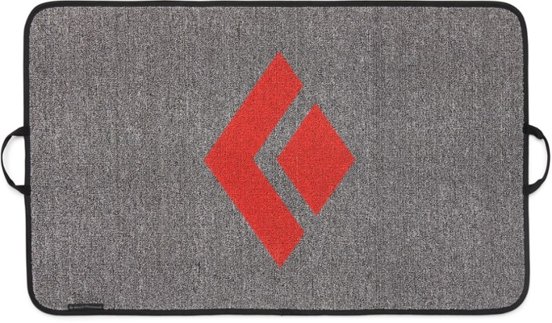 Black Diamond Sitstarter compact crash pad, view from top showing carpeted surface for shoe cleaning.