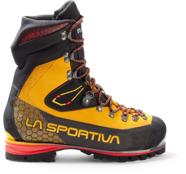La Sportiva Nepal Cube GTX boots on rocky terrain, showcasing durability and grip.