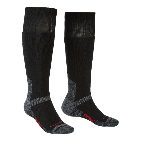 Bridgedale Explorer Heavyweight Knee Socks on a snowy trail, perfect for cold weather adventures.