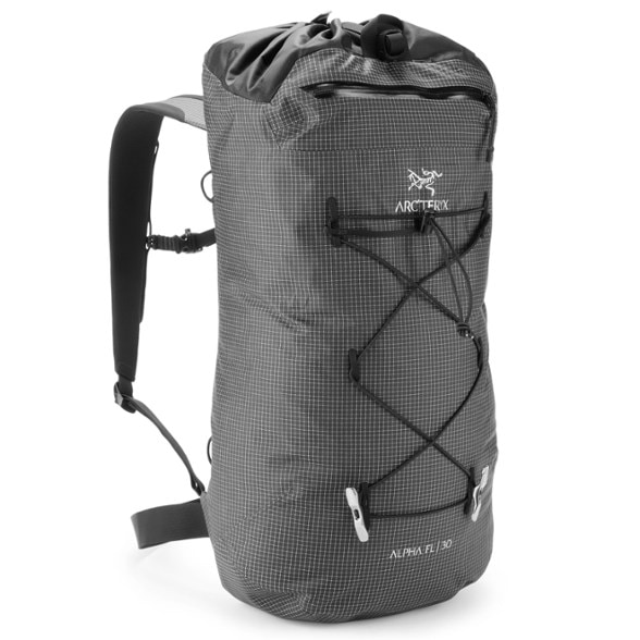 Side view of the Arc'teryx Alpha FL 30 Lightweight Climbing Backpack highlighting its weather-resistant fabric.