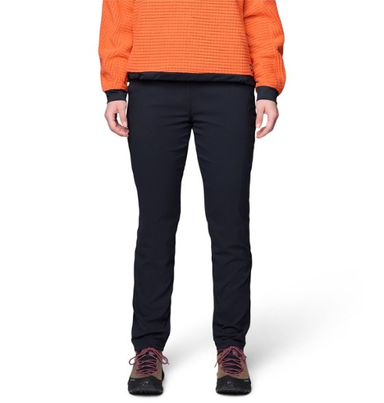 Mountain Hardwear Women's Thermal Stretch Hiking Pants modeled outdoors, showcasing water resistance and warmth.