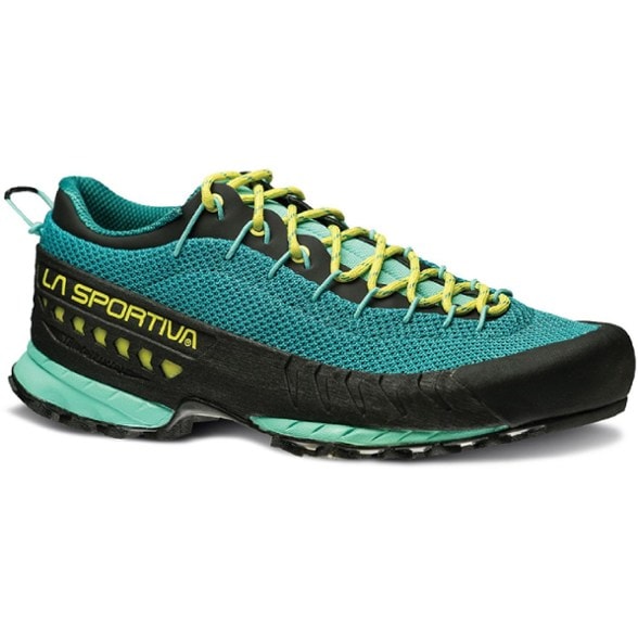 La Sportiva TX3 Women's Approach Shoes in action on rocky terrain, showcasing their grip and stability.