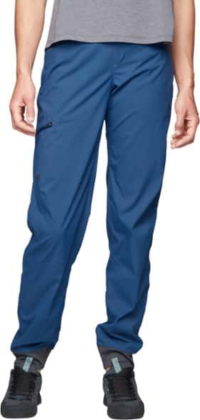 Front view of women's joggers worn on a climbing wall, showing articulated knee design and harness-compatible pockets