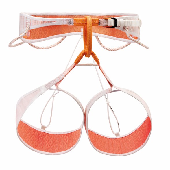 Petzl Whisper harness hanging on a climbing wall, showcasing its lightweight design and features.
