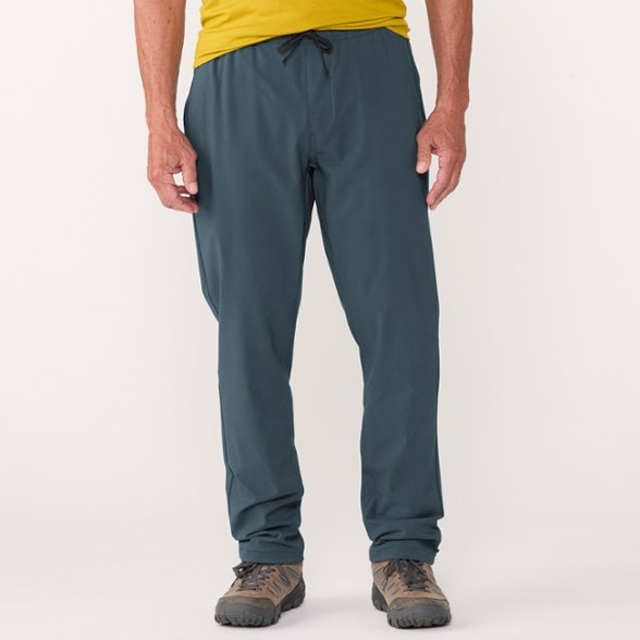 EcoFlex Adventure Pants for Men in action on a mountain trail