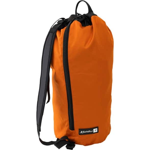 Metolius Dirt Bag II rope bag laid open showing large tarp in outdoor climbing setting