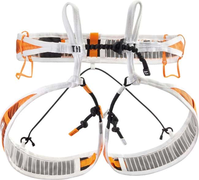 Petzl Fly harness worn by a mountaineer, highlighting its lightweight design and comfort.