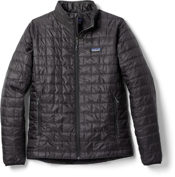 Patagonia Men's Nano Puff Insulated Jacket displayed on a model during a winter hike.
