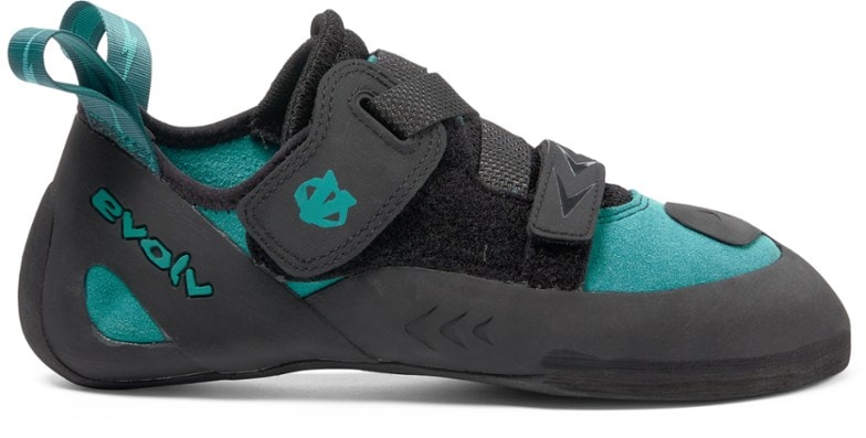 Side profile of women's climbing shoes showing hook-and-loop strap and textured TRAX rubber outsole