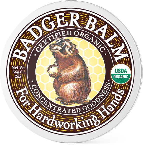 Close-up of Hardworking Hands balm tin showcasing the organic label and ingredients.