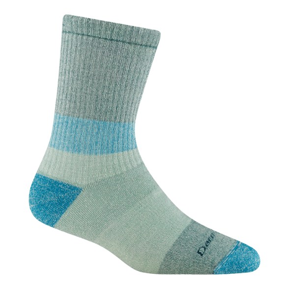Darn Tough women's merino wool mountaineering socks displayed on a rocky trail.