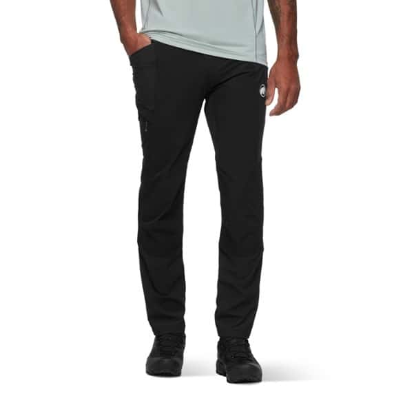 Mammut Ducan pants displayed in a hiking setting, showcasing flexibility and durability.