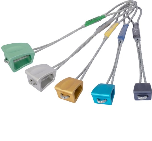 DMM Wallnut stopper set in various sizes displayed outdoors during rock climbing