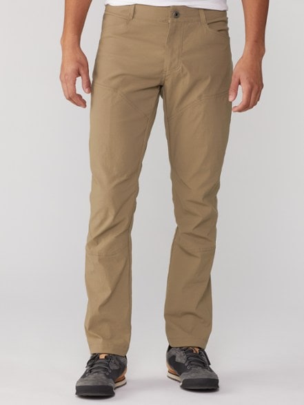 KUHL Renegade Men's Climbing Pants in action on a rocky ascent.