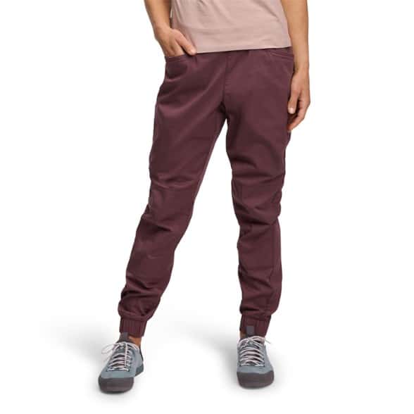 Close-up front angle of women's outdoor pants showing elastic waistband and zip pocket