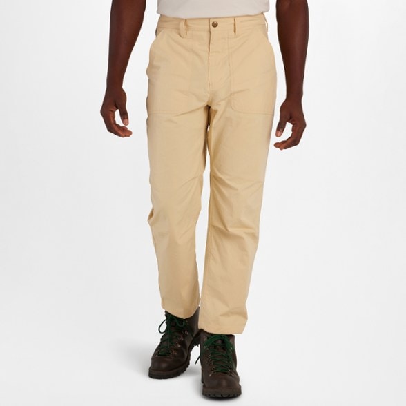 Side view of Marmot men's eco-friendly stretch hiking pants worn during a hike, highlighting their fit and design.