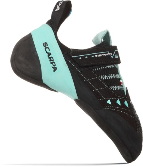 Scarpa Instinct VS women's climbing shoes showcasing the aggressive rubber outsole from a side angle.