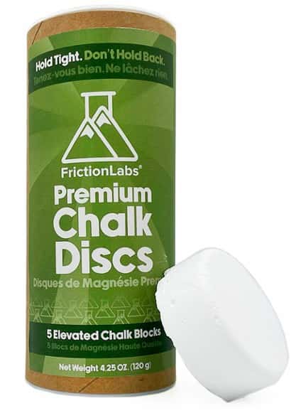FrictionLabs chalk discs in a portable tube for easy access during climbing and weightlifting.