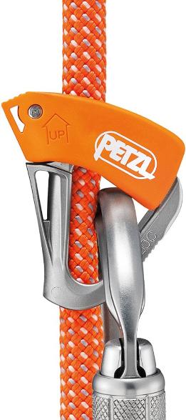 Close-up of Petzl Tibloc rope ascender showing stainless steel cam gripping rope