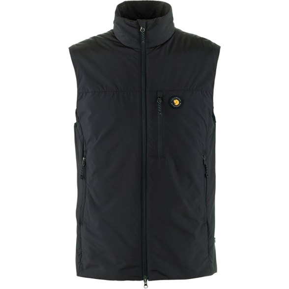 Bergtagen insulation vest displayed outdoors, showcasing its sleek design and functionality for mountaineering.