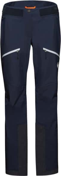 Mammut Women's Taiss Pro Hard-Shell Pants in action on a snowy mountain trail.