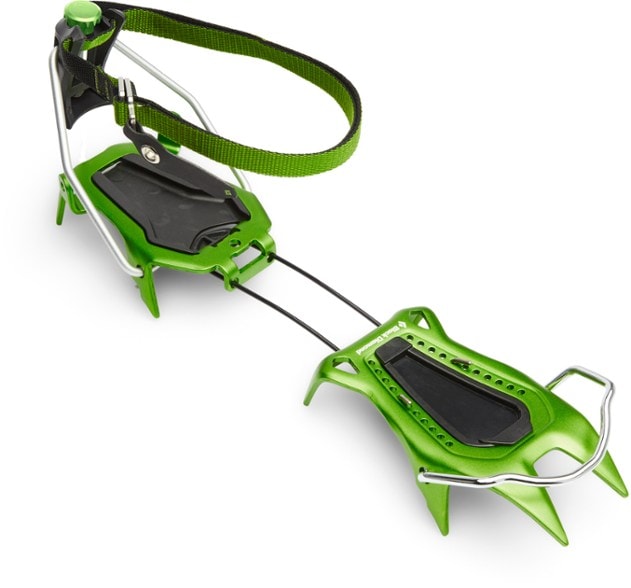 Neve Pro crampons on snow-covered terrain, showcasing their lightweight design.