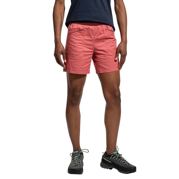 Side view of SummitFlow climbing shorts worn by woman on bouldering route, showing ergonomic fit and breathable fabric