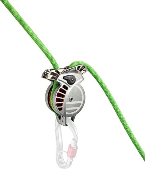 Revo Pro belay device in action during rock climbing, showcasing its safety features.