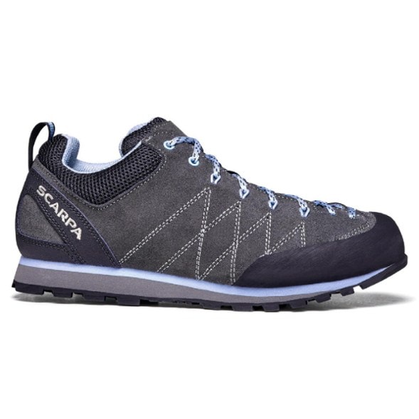 Crux Women's Approach Shoes in action on rocky terrain, highlighting their grip and durability.